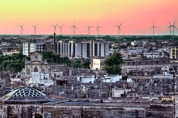 Skyline of the city of lecce with windmills in background